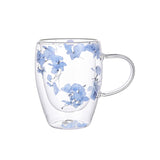 "Double-wall insulated glass coffee mug – heat-resistant, high-temperature safe, stylish dried flower design, elegant handle cup perfect for lattes, home, or office use."