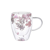 "Double-wall insulated glass coffee mug – heat-resistant, high-temperature safe, stylish dried flower design, elegant handle cup perfect for lattes, home, or office use."