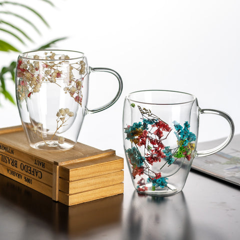 "Double-wall insulated glass coffee mug – heat-resistant, high-temperature safe, stylish dried flower design, elegant handle cup perfect for lattes, home, or office use."