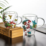 "Double-wall insulated glass coffee mug – heat-resistant, high-temperature safe, stylish dried flower design, elegant handle cup perfect for lattes, home, or office use."